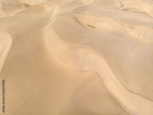 Aerial View of Sand Dunes in Gran Canaria with beautiful coast and beach, Canarian Islands, Spain