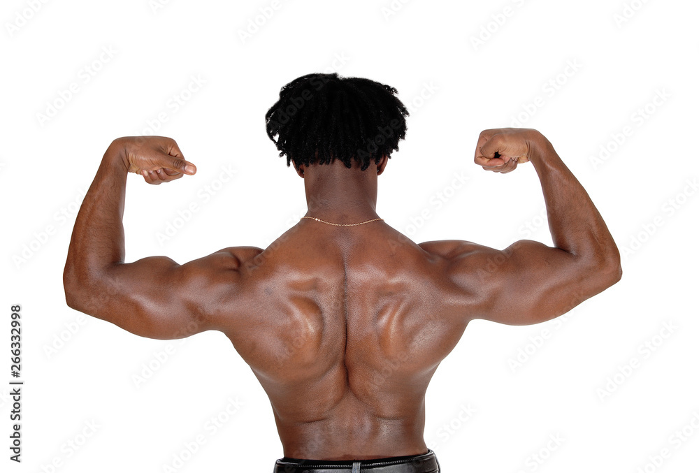 black man standing from the back flexing muscles black man standing from the back flexing muscles