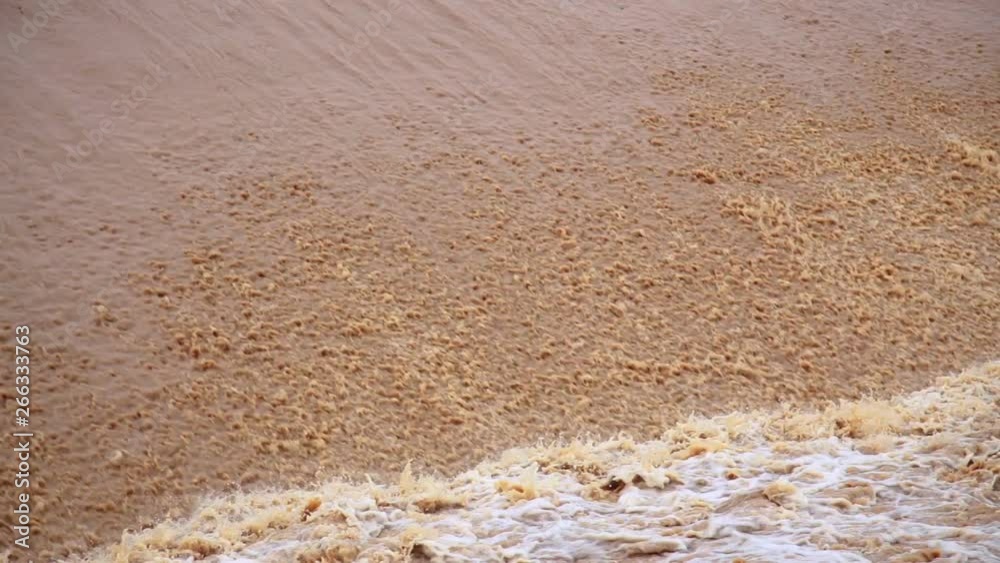 Rapid filling of the river with dirty water, during rain, mudslides Rapid filling of the river with dirty water, during rain, mudslides