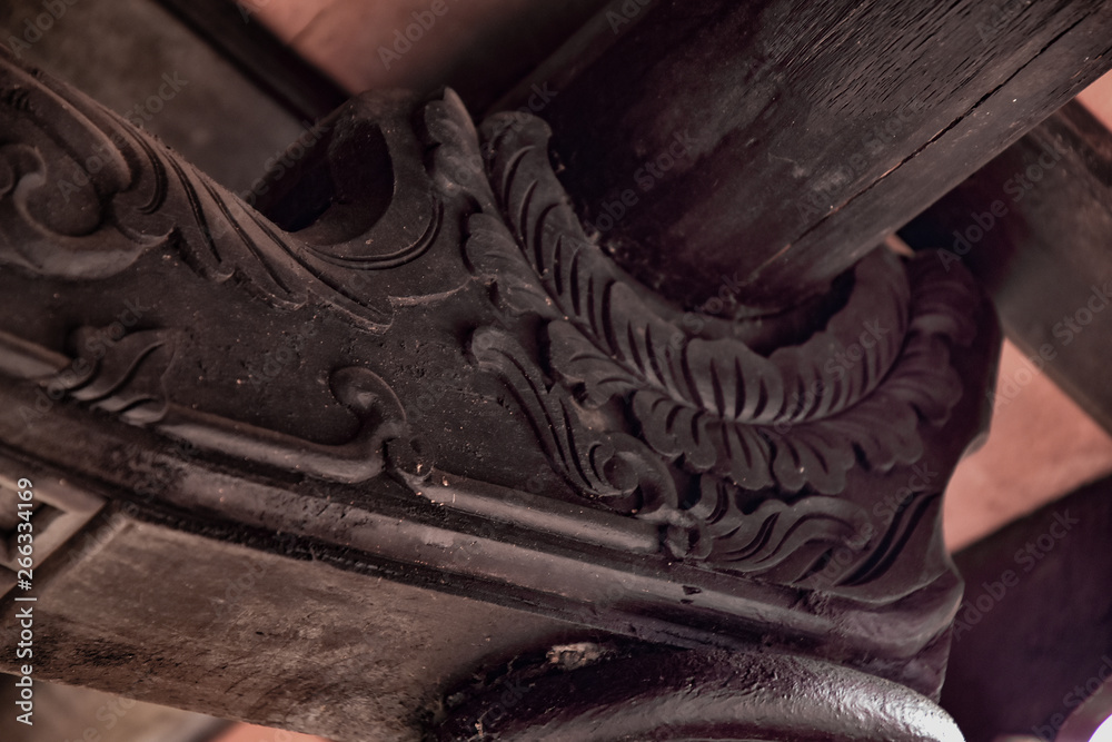 Element roof beams close-up with wood carving. Vietnamese national art