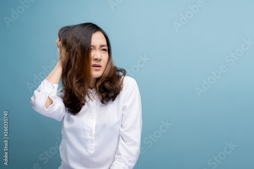 Woman scratching her head