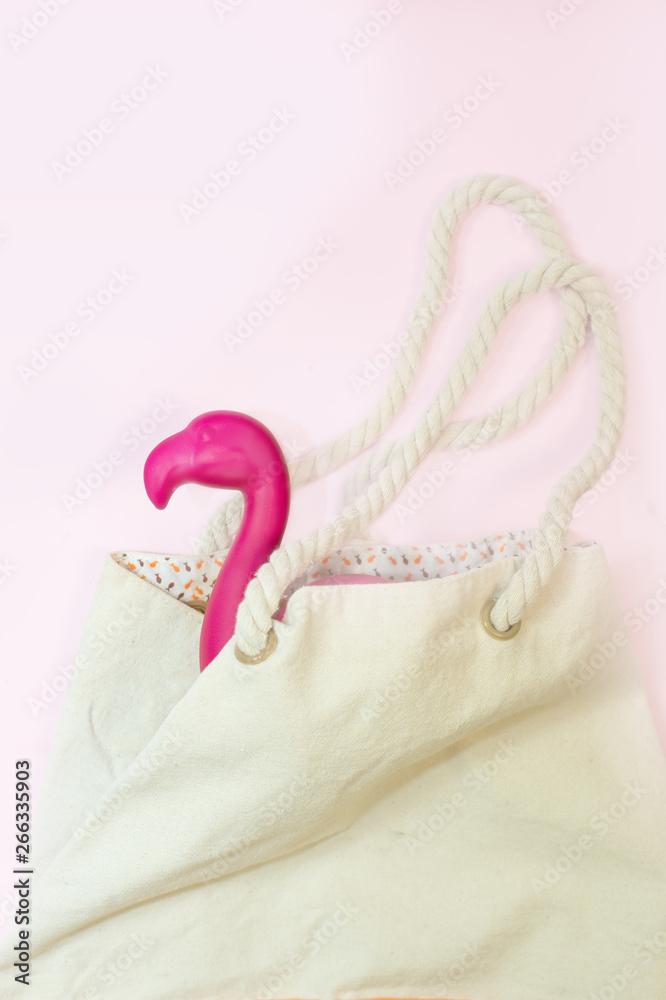 Tropical summer background with flamingo decor. View from above. Flat lay Tropical summer background with flamingo decor. View from above. Flat lay
