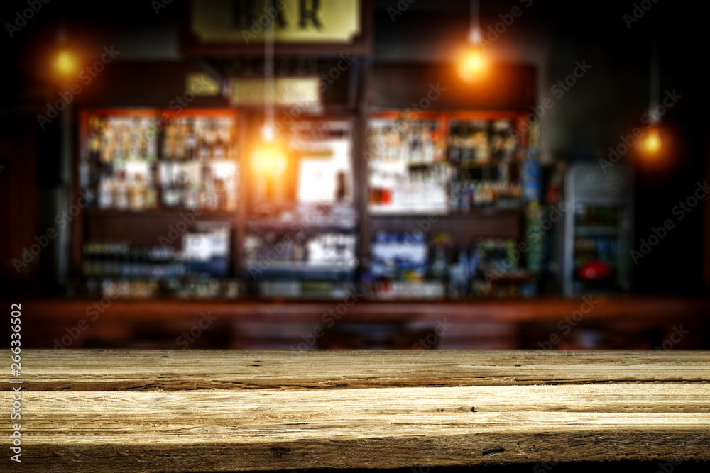 Table background of free space and blurred background of bar 