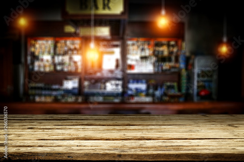 Table background of free space and blurred background of bar 