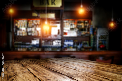 Table background of free space and blurred background of bar 