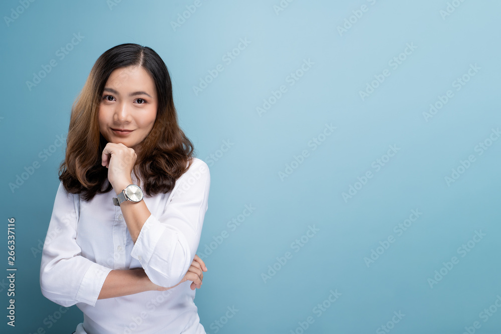 Portrait of a confident woman standing isolated over background Portrait of a confident woman standing isolated over background