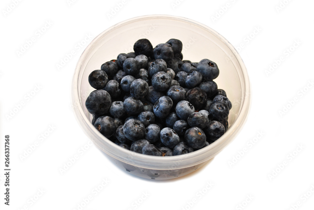 Fresh Whole Blue Berries in a Plastic Container Fresh Whole Blue Berries in a Plastic Container