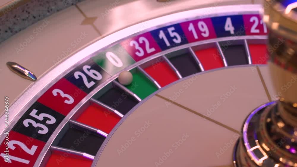 Roulette table in casino, with many games and slots, roulette wheel in the foreground. Golden and luxury light, casino interior. Gambling is the wagering of money or playing games of chance for money Roulette table in casino, with many games and slots, roulette wheel in the foreground. Golden and luxury light, casino interior. Gambling is the wagering of money or playing games of chance for money