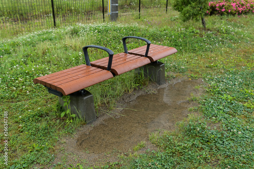 Park bench wet in the rain 仙台空港臨空公園のベンチ photo