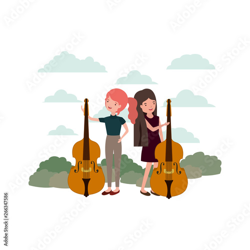 women with musical instruments in landscape