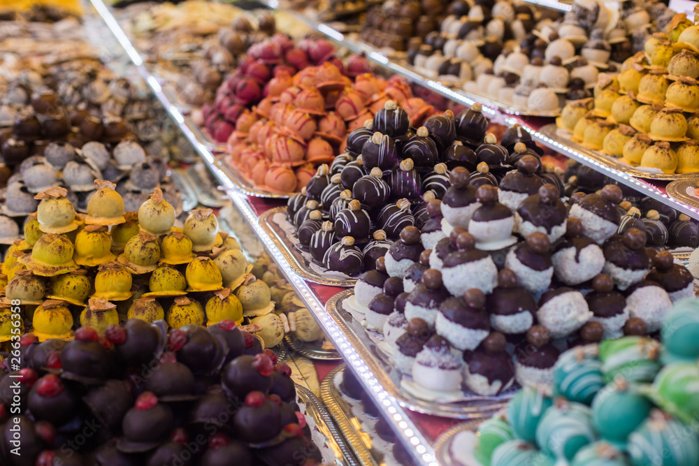 Marсipan store in Budapest. A counter with delicious sweets. Multi-colored marzipans