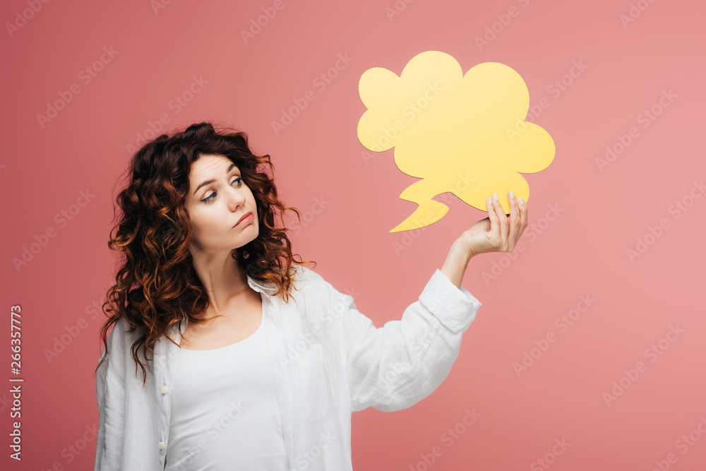 beautiful curly girl with red hair holding yellow thought bubble on pink beautiful curly girl with red hair holding yellow thought bubble on pink