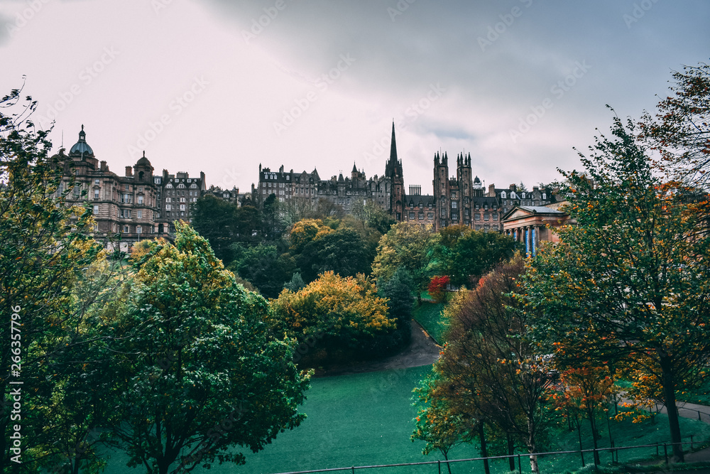Historic buildings and a green park in Edinburgh, Scotland