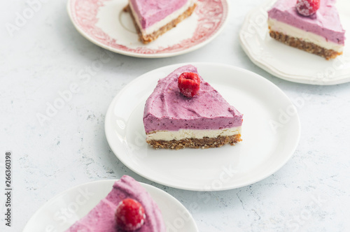 Raw cashew cake with raspberries. Sugar, milk and gluten-free dessert photo