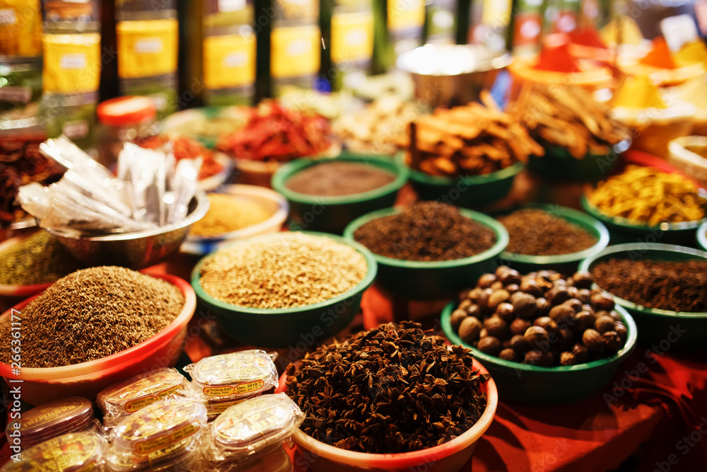 Colorful spices in bags at a market in Goa