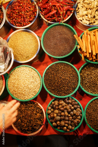 Colorful spices in bags at a market in Goa