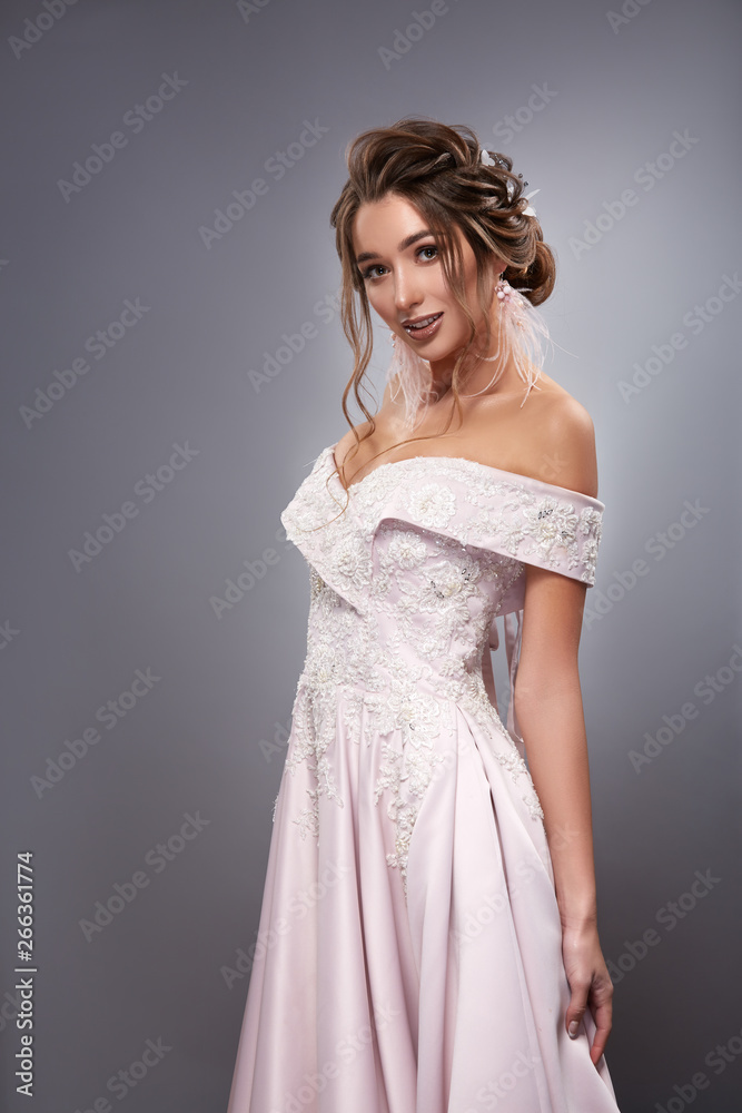 pretty bride in white dress with naked shoulders and curls pretty bride in white dress with naked shoulders and curls