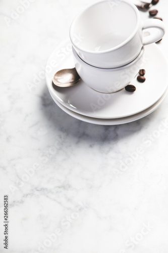 Coffee composition on white marble background  copyspace