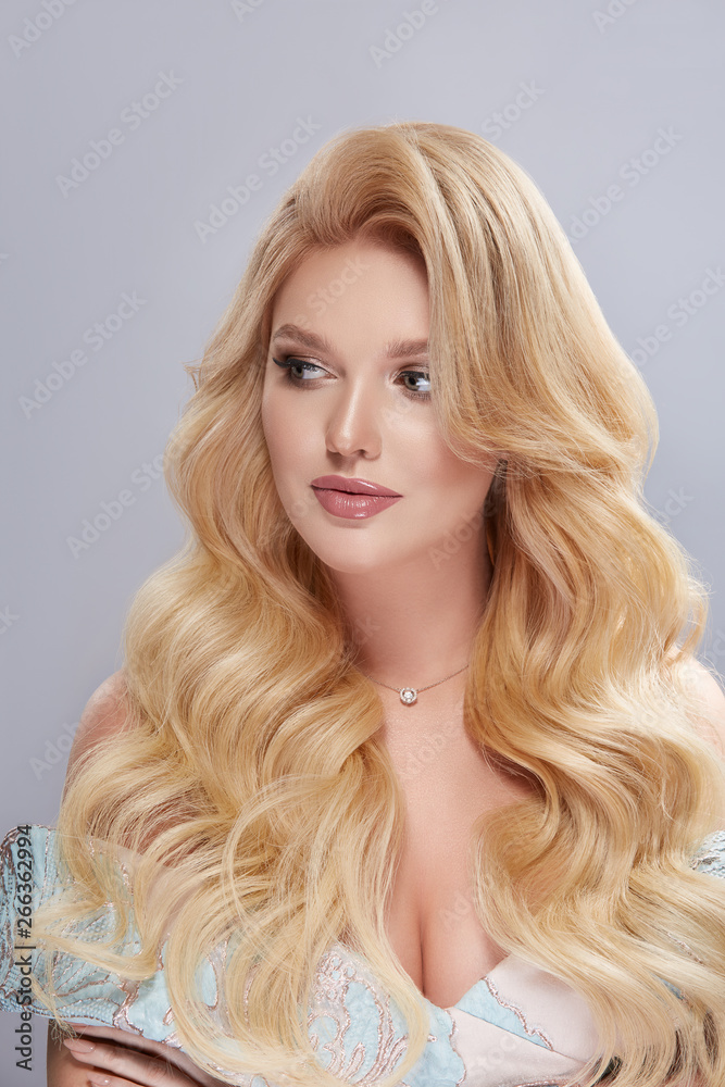 portrait of elegant blond with long hair looking to the side portrait of elegant blond with long hair looking to the side