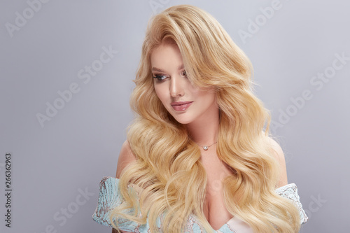 luxury woman with shiny hair and big breast looking down