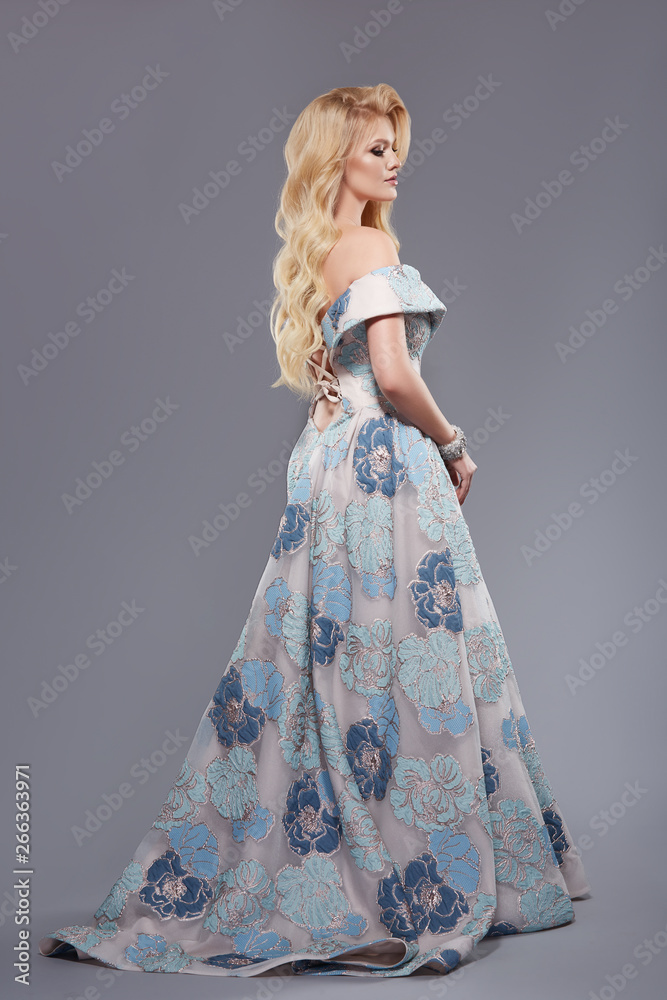 profile portrait of full body woman in long and lush evening dress profile portrait of full body woman in long and lush evening dress