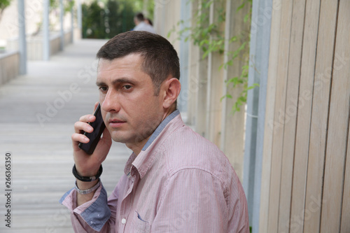 close-up. Portrait of a handsome young man businessman talking on cell phone