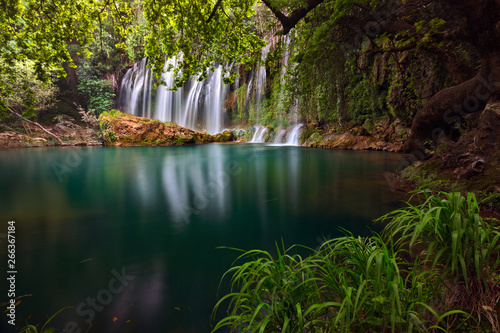 Stunning waterfalls with small emerald lake in deep green forest in Kursunlu Natural Park  Antalya  Turkey