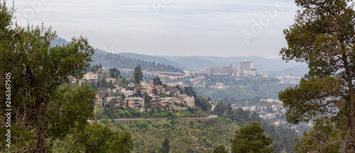 Beautiful view of residential homes on top of a hill in a city during a cloudy day. Taken in Jerusalem, Israel. © edb3_16