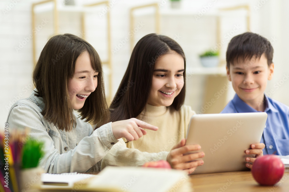 School Kids With Tablet Computer Having Fun On Break School Kids With Tablet Computer Having Fun On Break
