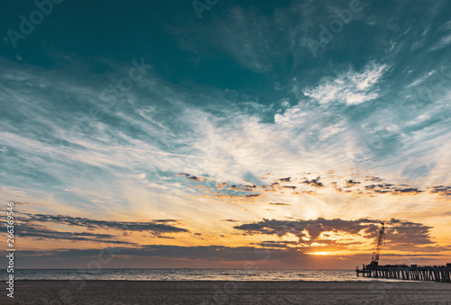 colorful early morning sky over the ocean pier © Alina McCullen