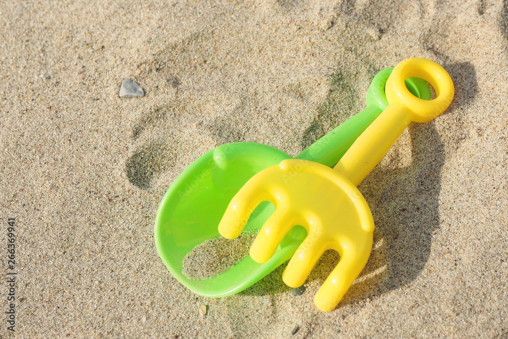 Children's toys shovel, rakes and traces of them in the sand... Children's toys shovel, rakes and traces of them in the sand...