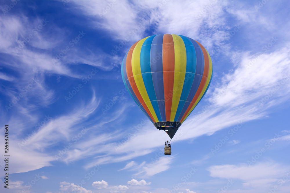 Fototapeta premium Colorful hot-air balloon flying in the blue sky