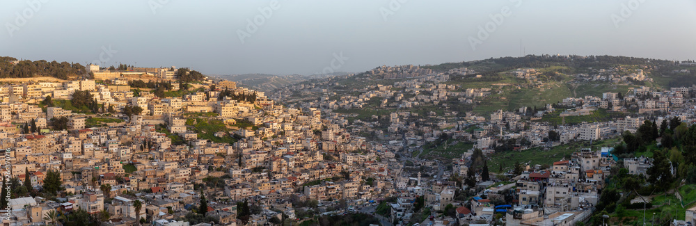 Aerial panoramic cityscape view of residential neighborhood during a sunny sunset. Taken in Jerusalem, Israel.