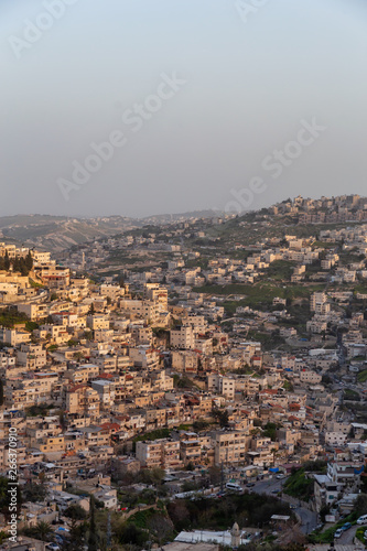 Aerial cityscape view of residential neighborhood during a sunny sunset. Taken in Jerusalem, Israel. © edb3_16