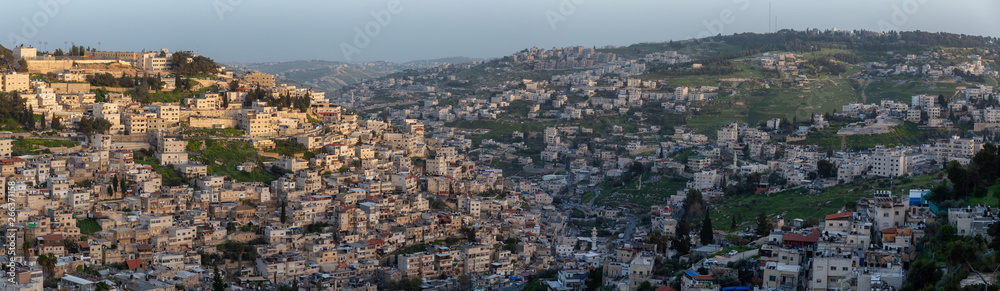Aerial panoramic cityscape view of residential neighborhood during a sunny sunset. Taken in Jerusalem, Israel. Aerial panoramic cityscape view of residential neighborhood during a sunny sunset. Taken in Jerusalem, Israel.
