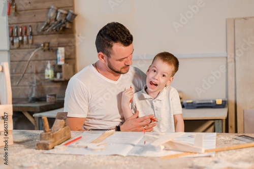 Father and son in the carpentry shop