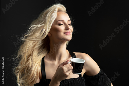 Beauty blonde woman coffee cup hold.