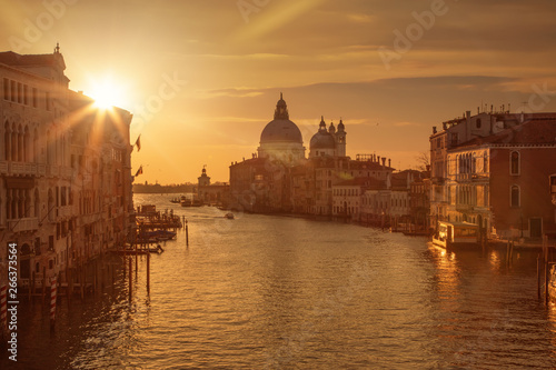 Beautiful sunrise over the canale grande in Venice, italy with the Santa Maria in the background © Cara-Foto