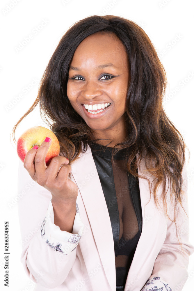 Attractive cheerful sexy african woman holding big red apple on palm hand Attractive cheerful sexy african woman holding big red apple on palm hand