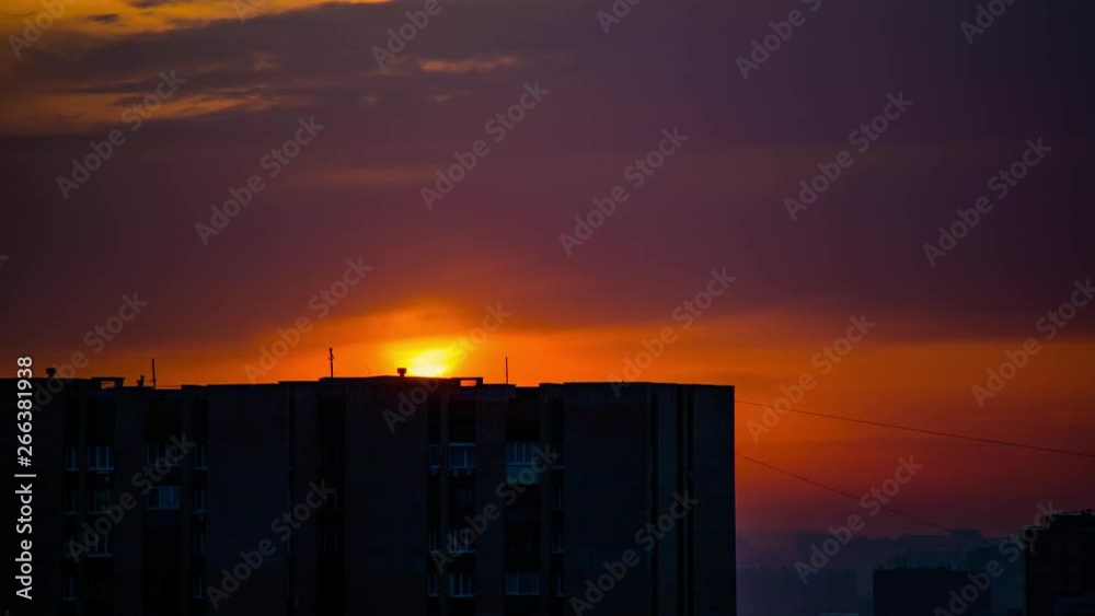 Time Lapse of sunset, with big golden sun, against the background of the city Time Lapse of sunset, with big golden sun, against the background of the city