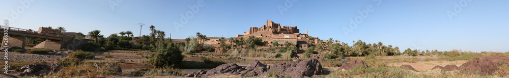 Panoramic photos of buildings and ancient historical places called alqasbat and oases and natural mountains in Morocco are located in the Ouarzazate region near the Moroccan Sahara