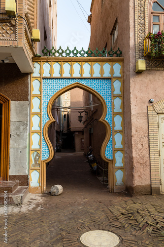 Kashgar, Xinjinag, China: arabic style decorated archway in the streets of Kashgar Ancient Town. Kashgar is a popular tourist place along the Silk Road and one of the westernmost cities of China photo