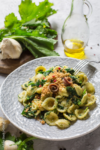 Bild auf Leinwand Italian first course - pasta Orecchiette con le cime di rapa e  le acciughe  popular in Southern Italy, typical of Apulia