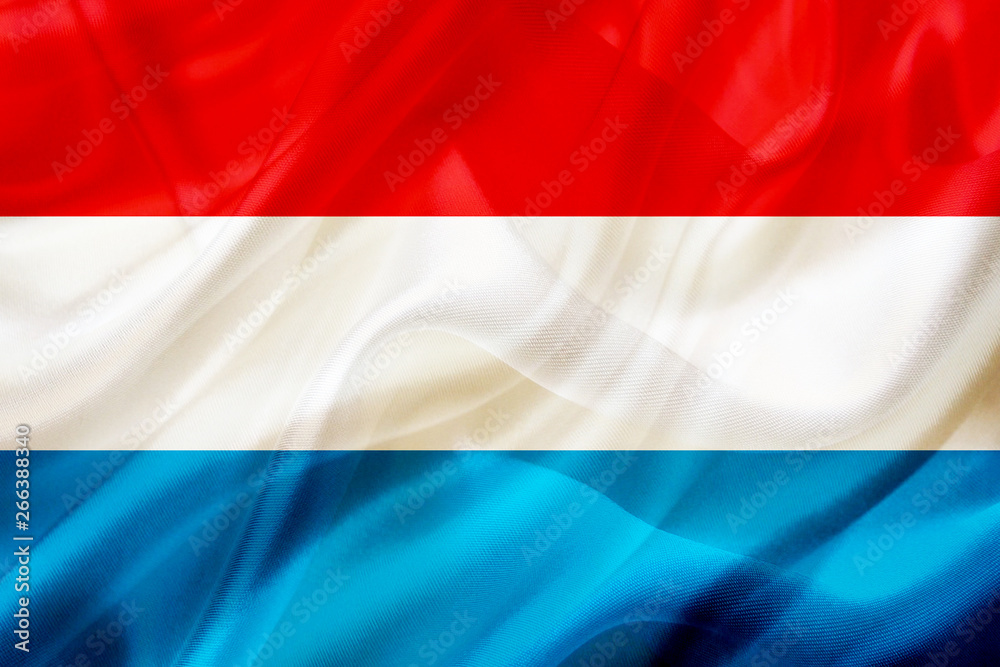 Fototapeta premium Luxembourg country flag on silk or silky waving texture