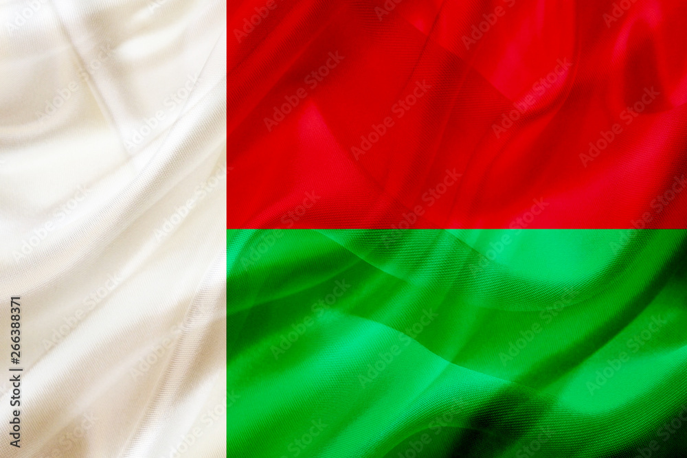 Madagascar country flag on silk or silky waving texture