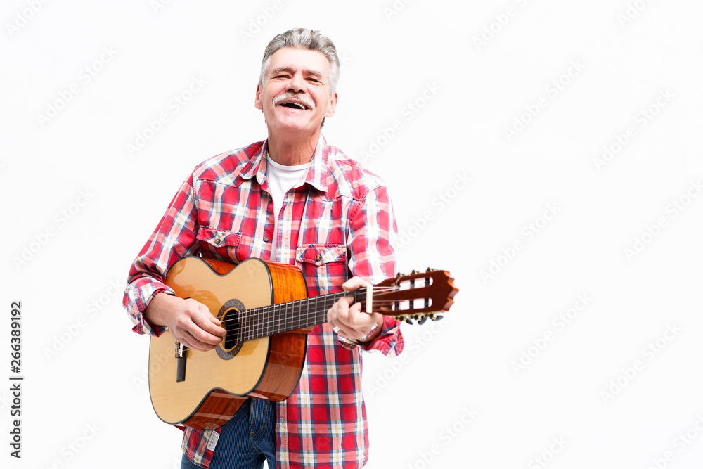 Handsome bearded senior man is playing guitar and smilling! Handsome bearded senior man is playing guitar and smilling!