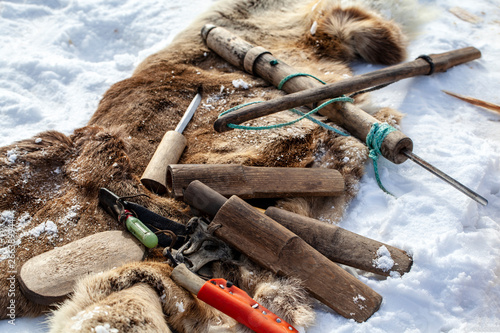 Hand tools for wood carving, making sled reindeer sleigh, Residents of the far north, the pasture of Nenets people,a knife and an ax