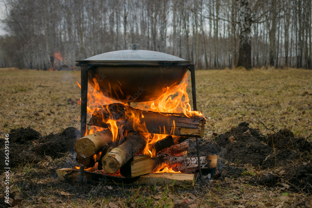Cooking food in nature. Field kitchen in a campaign or on hunting or fishing. Cooking food in nature. Field kitchen in a campaign or on hunting or fishing.