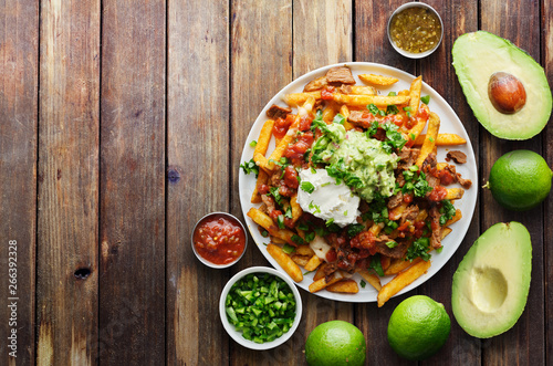mexican carne asada fries in copy space composition shot from birds eye view photo