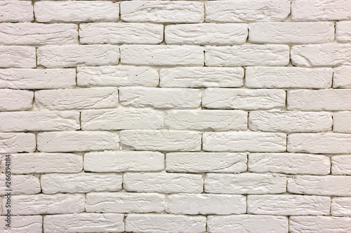 Close-up of white painted whitewashed solid brick wall. Abstract copy space background, Bricklaying, construction and masonry concept.